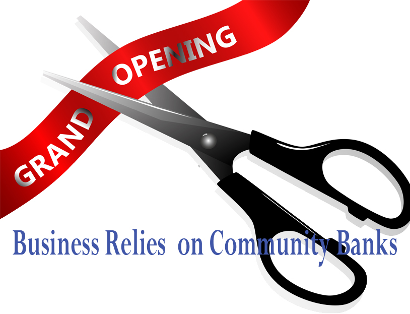 Scissors cutting a red ribbon at a grand opening